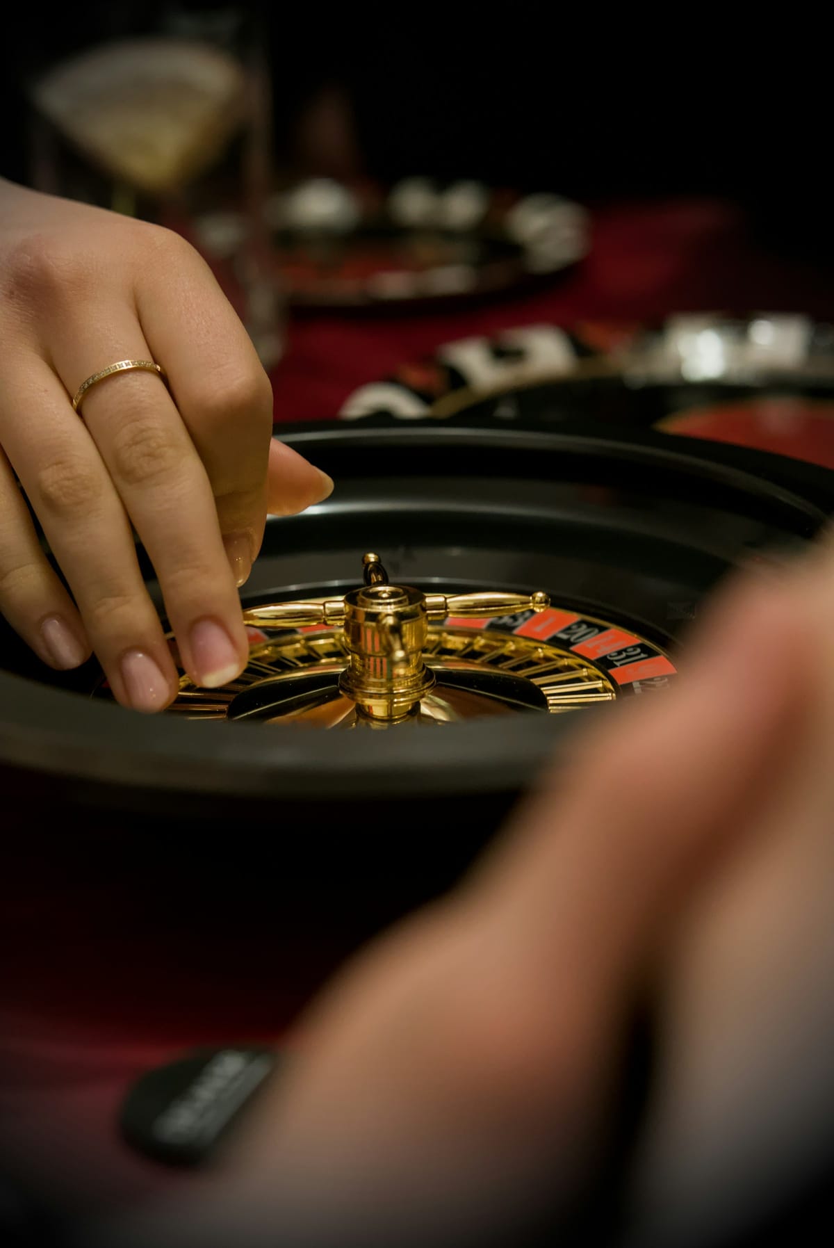 Dealer’s hands at a roulette table